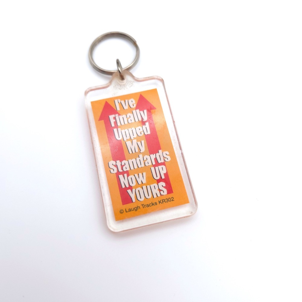 Vintage Laugh Tracks KR302 Upped My Standards Up Yours Keychain Retro Korea Gag